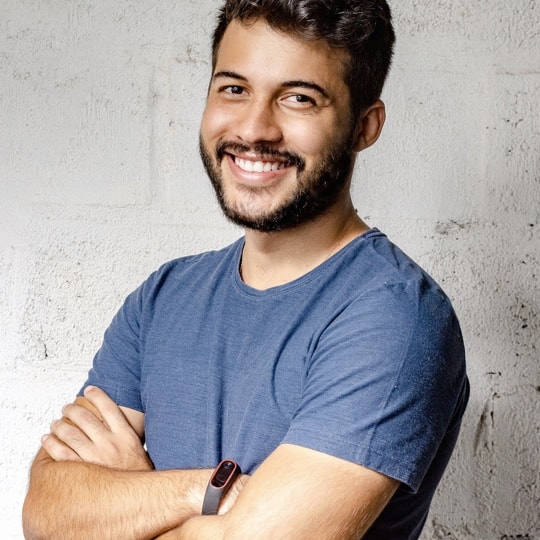 an young man with with smile on his face wearing half-sleeve T-shirt